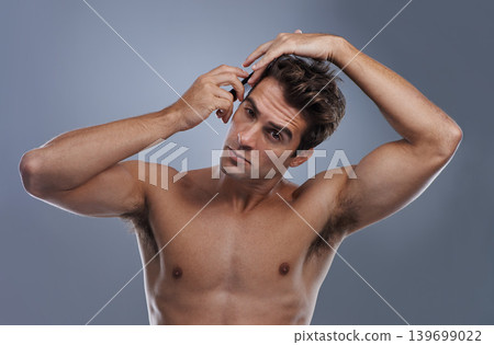 Man, portrait and comb hair in studio for grooming style on grey background for hygiene, self care and shirtless. Male person, model and face with brush for routine in morning, health or mockup space 139699022