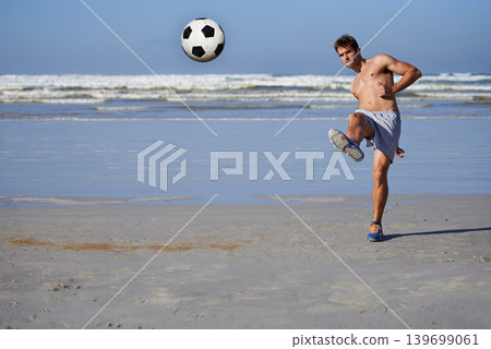 Man, beach and soccer ball in fitness, exercise or outdoor hobby for surfing or practice. Young male person or sports player kicking on ocean coast for football game, match or friendly by the seaside Man, beach and soccer ball in fitness, exercise or outdoor hobby for surfing or practice. Young male person or sports player kicking on ocean coast for football game, match or friendly by the seaside 139699061
