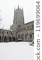 Bryn Athyn Cathedral stone tower and cloisters courtyard during winter snow. 139699064