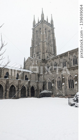 Bryn Athyn Cathedral stone tower and cloisters courtyard during winter snow. Bryn Athyn Cathedral stone tower and cloisters courtyard during winter snow. 139699064
