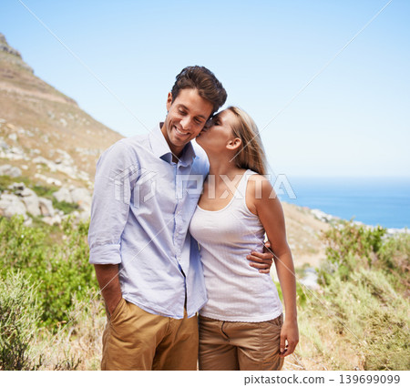 Happy couple, love and kiss on mountains for travel, journey and holiday in nature with summer or valentines day. Young. romantic people hug on a date, hiking and tourism in Cape Town, South Africa Happy couple, love and kiss on mountains for travel, journey and holiday in nature with summer or valentines day. Young. romantic people hug on a date, hiking and tourism in Cape Town, South Africa 139699099