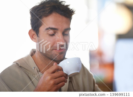 Smile, coffee and young man in a cafe with positive, good and confident attitude in morning. Happy, cappuccino and male person drinking caffeine, espresso or latte beverage in mug at restaurant. Smile, coffee and young man in a cafe with positive, good and confident attitude in morning. Happy, cappuccino and male person drinking caffeine, espresso or latte beverage in mug at restaurant. 139699111