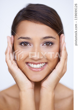 Portrait, cosmetics and woman with skincare, smile and treatment on white studio background. Face, Indian person and model with beauty or dermatology with healthy skin, smooth or shine with aesthetic Portrait, cosmetics and woman with skincare, smile and treatment on white studio background. Face, Indian person and model with beauty or dermatology with healthy skin, smooth or shine with aesthetic 139699126