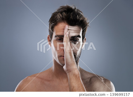 Man, hand and half face or shave for hair removal on grey background for transformation, comparison or before and after. Male person, portrait and cleaning beard care for health and mockup space 139699157