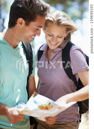 Couple, hiking in forest and lost with map, documents guide or location information for nature travel or journey. Young woman and man trekking and planning or search paper for direction in the woods Couple, hiking in forest and lost with map, documents guide or location information for nature travel or journey. Young woman and man trekking and planning or search paper for direction in the woods 139699165