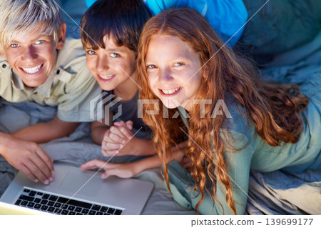 Children, portrait and relax with laptop on floor together with happiness and online games for holiday or vacation. Kids, smile and playing with computer on website, streaming or search on internet Children, portrait and relax with laptop on floor together with happiness and online games for holiday or vacation. Kids, smile and playing with computer on website, streaming or search on internet 139699177
