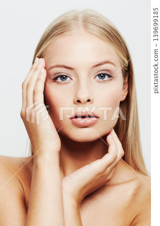 Woman, portrait and hands on skin for beauty, natural cosmetics and glamour on white background. Clean face skincare and dermatology with makeup, wellness and facial for treatment for makeover Woman, portrait and hands on skin for beauty, natural cosmetics and glamour on white background. Clean face skincare and dermatology with makeup, wellness and facial for treatment for makeover 139699185