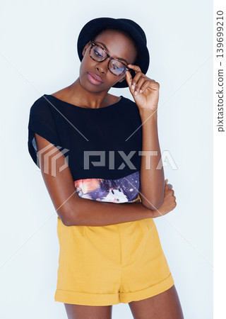 Fashion, glasses and African woman on a white background in trendy, stylish and casual clothes. Confidence, hipster style and isolated attractive person with accessory, hat and aesthetic in studio Fashion, glasses and African woman on a white background in trendy, stylish and casual clothes. Confidence, hipster style and isolated attractive person with accessory, hat and aesthetic in studio 139699210