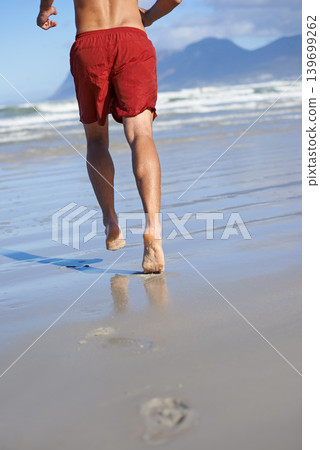 Man, lifeguard and legs running on beach for security, safety and outdoor swimming emergency. Rear view or back of male person or professional swimmer ready on patrol or rescue at sea or ocean coast Man, lifeguard and legs running on beach for security, safety and outdoor swimming emergency. Rear view or back of male person or professional swimmer ready on patrol or rescue at sea or ocean coast 139699262