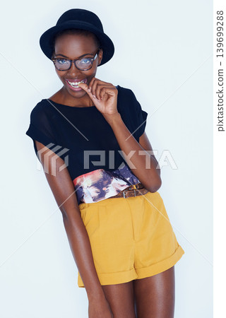 Portrait, funny and black woman with fashion, glasses and stylish clothes on a white studio background. African person, girl and model with eyewear and casual outfit with gen z and goofy with fun Portrait, funny and black woman with fashion, glasses and stylish clothes on a white studio background. African person, girl and model with eyewear and casual outfit with gen z and goofy with fun 139699288