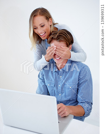 Laptop, cover eyes and couple on sofa in home for internet, online website and social networking. Happy, surprise and man and woman on computer for relaxing, streaming subscription and remote work Laptop, cover eyes and couple on sofa in home for internet, online website and social networking. Happy, surprise and man and woman on computer for relaxing, streaming subscription and remote work 139699311