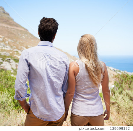 Couple, holding hands and mountain for hiking, journey or outdoor adventure together. Rear view or back of man and woman in love, commitment or support for trust, holiday or weekend in Cape Town Couple, holding hands and mountain for hiking, journey or outdoor adventure together. Rear view or back of man and woman in love, commitment or support for trust, holiday or weekend in Cape Town 139699352