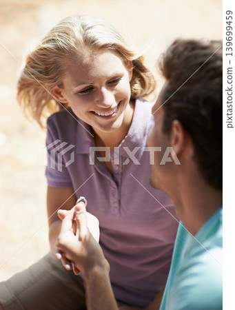 Happy couple, engagement and ring in nature for marriage, love or commitment in forest or outdoor romance. Young man proposing to woman or lovers smile in embrace or affection for wedding proposal 139699459