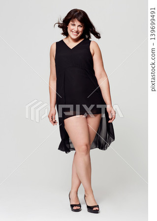 Fashion portrait, studio dress and happy woman with glamour outfit, trendy style or elegant apparel. Classy, evening wear and confident person smile for fancy clothes isolated on white background Fashion portrait, studio dress and happy woman with glamour outfit, trendy style or elegant apparel. Classy, evening wear and confident person smile for fancy clothes isolated on white background 139699491