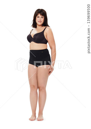 Portrait, confidence and plus size woman in underwear in studio isolated on a white background mockup space. Person, model and body positivity, self acceptance or natural beauty of healthy young girl 139699500