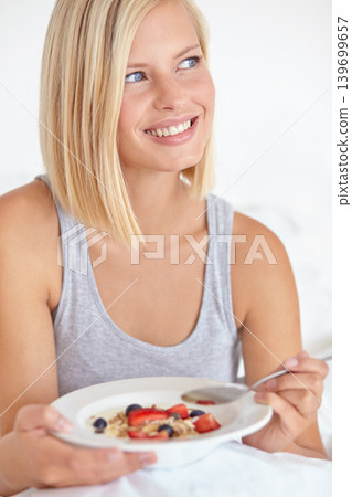 Woman, thinking and breakfast in bedroom, hotel and wake up for morning hospitality or accommodation. Relax, cereal and holiday with young person in bed with fruit, weekend and comfortable with food Woman, thinking and breakfast in bedroom, hotel and wake up for morning hospitality or accommodation. Relax, cereal and holiday with young person in bed with fruit, weekend and comfortable with food 139699657