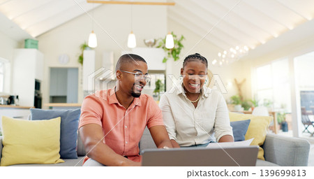 Technology, married couple celebrating and laptop on a sofa in living room of their home. Social media or online communication, success or high five and black people together happy for connectivity Technology, married couple celebrating and laptop on a sofa in living room of their home. Social media or online communication, success or high five and black people together happy for connectivity 139699813
