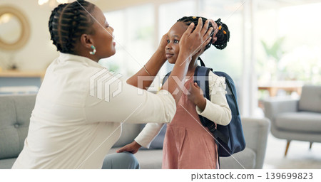Getting ready, morning and a mother with a child for school, leaving kiss and talking in the living room. Happy, speaking and an African mom helping a girl with a backpack in a house for kindergarten Getting ready, morning and a mother with a child for school, leaving kiss and talking in the living room. Happy, speaking and an African mom helping a girl with a backpack in a house for kindergarten 139699823
