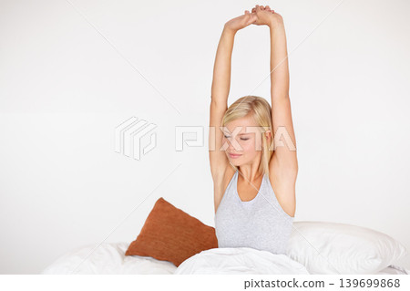 Woman, morning and stretching in bed for relax routine in home or weekend wake up for comfort, rest or lazy. Female person, mockup space and linen bedding in apartment for peace, tired or wellness Woman, morning and stretching in bed for relax routine in home or weekend wake up for comfort, rest or lazy. Female person, mockup space and linen bedding in apartment for peace, tired or wellness 139699868