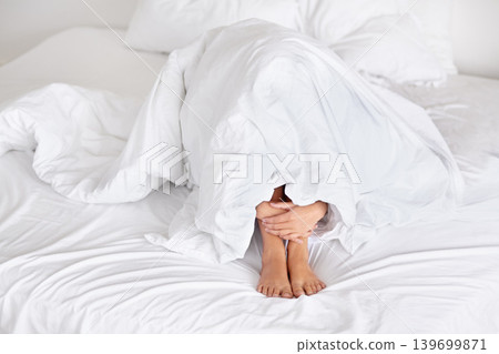 Anxiety, feet and hands in bed with blanket, depression or comfort from fear, panic attack or stress at home. Fail, trauma or person in a bedroom with mental health crisis, scared or hiding in shame Anxiety, feet and hands in bed with blanket, depression or comfort from fear, panic attack or stress at home. Fail, trauma or person in a bedroom with mental health crisis, scared or hiding in shame 139699871
