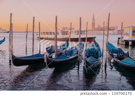 Traditional Gondolas Near Venetian Waterfront, Italy Transport. Italian culture 139700170