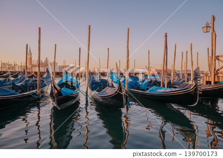 Gondolas Moored in Venice Lagoon with San Giorgio Maggiore in Background. Italy travel, tourism, romantic destinations and historic European atmosphere. 139700173