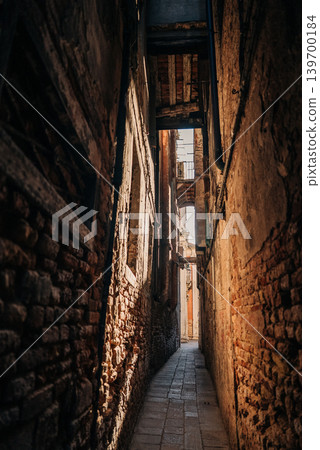 Historic Narrow Venice street without people, classic Italian architecture Historic Narrow Venice street without people, classic Italian architecture 139700184
