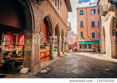 Morning atmosphere at Rialto Market in historic Venice, Italy. Local scene near the Grand Canal. Morning atmosphere at Rialto Market in historic Venice, Italy. Local scene near the Grand Canal. 139700200