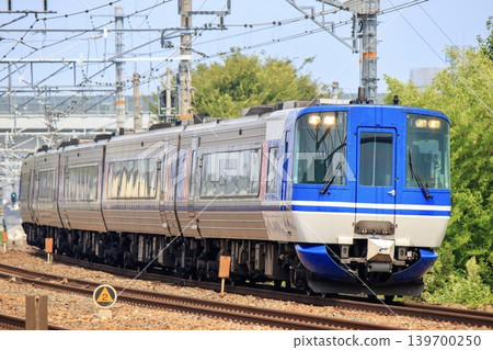The HOT7000 series Super Hakuto limited express train running on the JR Kyoto Line The HOT7000 series Super Hakuto limited express train running on the JR Kyoto Line 139700250