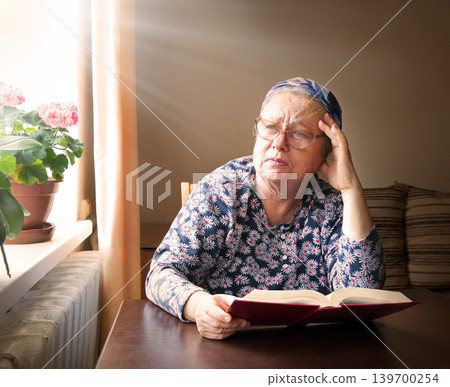 Old woman with big bpook Old woman with big bpook 139700254