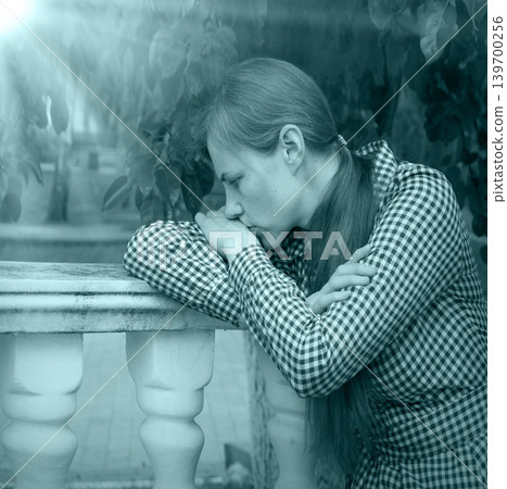 Sad girl in the park Sad girl in the park 139700256