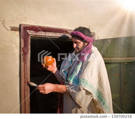 Man painting door with blood Man painting door with blood 139700258