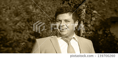 Smiling man in the park Smiling man in the park 139700260