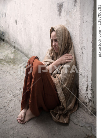 Frozen girl sitting on the floor Frozen girl sitting on the floor 139700283
