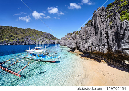 Traditional Philippines boat, Beautiful tropical beach on small island 139700464