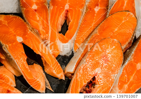 Raw salmon steak fish fresh seafood supermarket counter background sea food freshness Raw salmon steak fish fresh seafood supermarket counter background sea food freshness 139701007