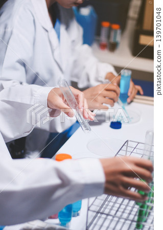 Researchers working in the clinical laboratory Researchers working in the clinical laboratory 139701048