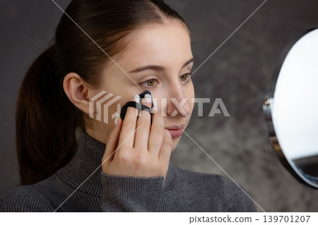 Young Girl Applying Mascara To Eyelashes In Close-Up View, Wide-Open Eye In Precision And Detaile Of The Makeup Process 139701207