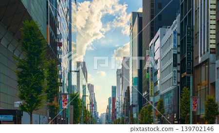 Tokyo, Japan - Oct 14 2024, panoramic view of the main street in the Ginza district, with people walking along the road and the glass facades of skyscrapers in the background, at daytime, Tokyo, Japan 139702146