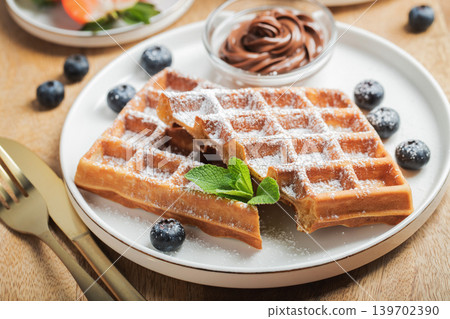Belgium waffles Homemade waffles with strawberries Belgium waffles Homemade waffles with strawberries 139702390