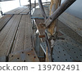 Clamps for the frame bracing of temporary scaffolding at industrial tank construction sites. 139702491