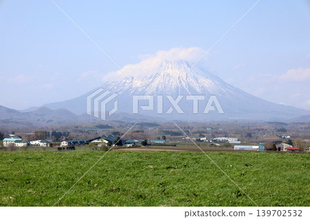 In early May, in springtime Hokkaido, at Lake Toya in central Hokkaido, Mount Yotei (also known as Ezo Fuji) can be seen from Lake Hill Farm on the lakeshore. In early May, in springtime Hokkaido, at Lake Toya in central Hokkaido, Mount Yotei (also known as Ezo Fuji) can be seen from Lake Hill Farm on the lakeshore. 139702532