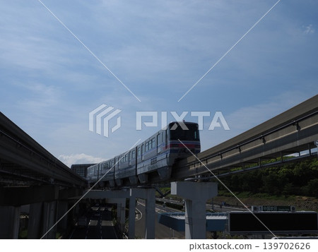 A dynamic low-angle shot of the monorail taken from a pedestrian overpass. A dynamic low-angle shot of the monorail taken from a pedestrian overpass. 139702626