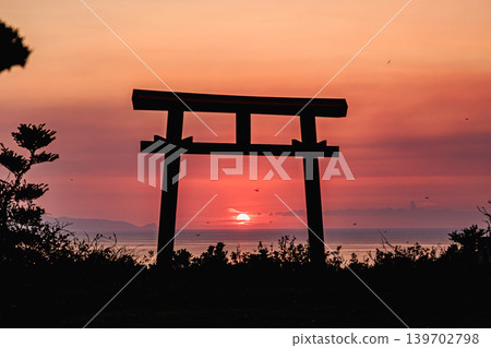 Yakushima's Yahazudake Shrine bathed in the divine light of the setting sun. Yakushima's Yahazudake Shrine bathed in the divine light of the setting sun. 139702798