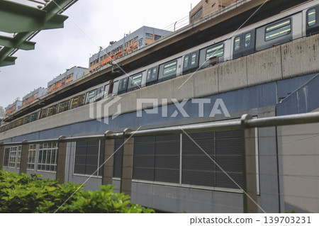 May 16 2026 Kwun Tong elevated train passing industrial buildings urban scene May 16 2026 Kwun Tong elevated train passing industrial buildings urban scene 139703231