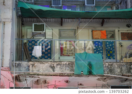 May 15 2026 Old Hong Kong residential facade with laundry hanging balcony May 15 2026 Old Hong Kong residential facade with laundry hanging balcony 139703262