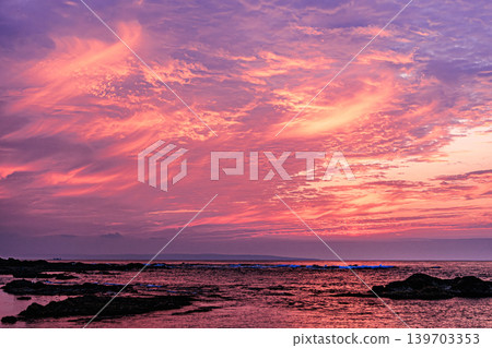 Morning view of Harutahama Beach, with the sky reflected in the tide pools. Morning view of Harutahama Beach, with the sky reflected in the tide pools. 139703353