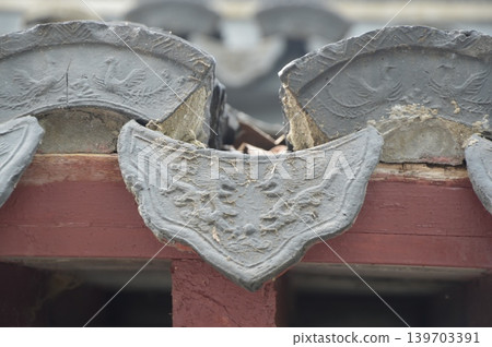 Close-up of an old tiled roof in Chinese architecture Close-up of an old tiled roof in Chinese architecture 139703391