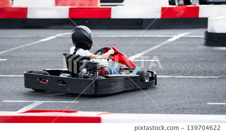 Child Quickly Drives On Children'S Kart Racing Track Child Quickly Drives On Children'S Kart Racing Track 139704622