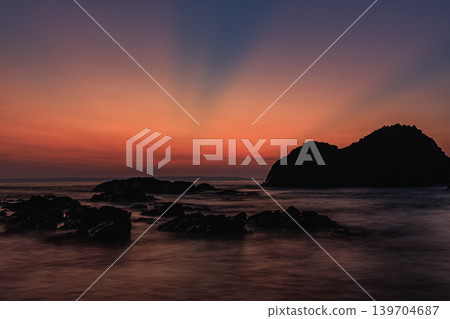 The beautiful coastal scenery of Yakushima: Pillow lava formations on Tashiro Beach and the dawn sky. The beautiful coastal scenery of Yakushima: Pillow lava formations on Tashiro Beach and the dawn sky. 139704687
